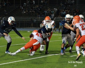 Josh McNish-Heider makes a tackle against Granite HIlls on Friday, Sept. 4, 2015.